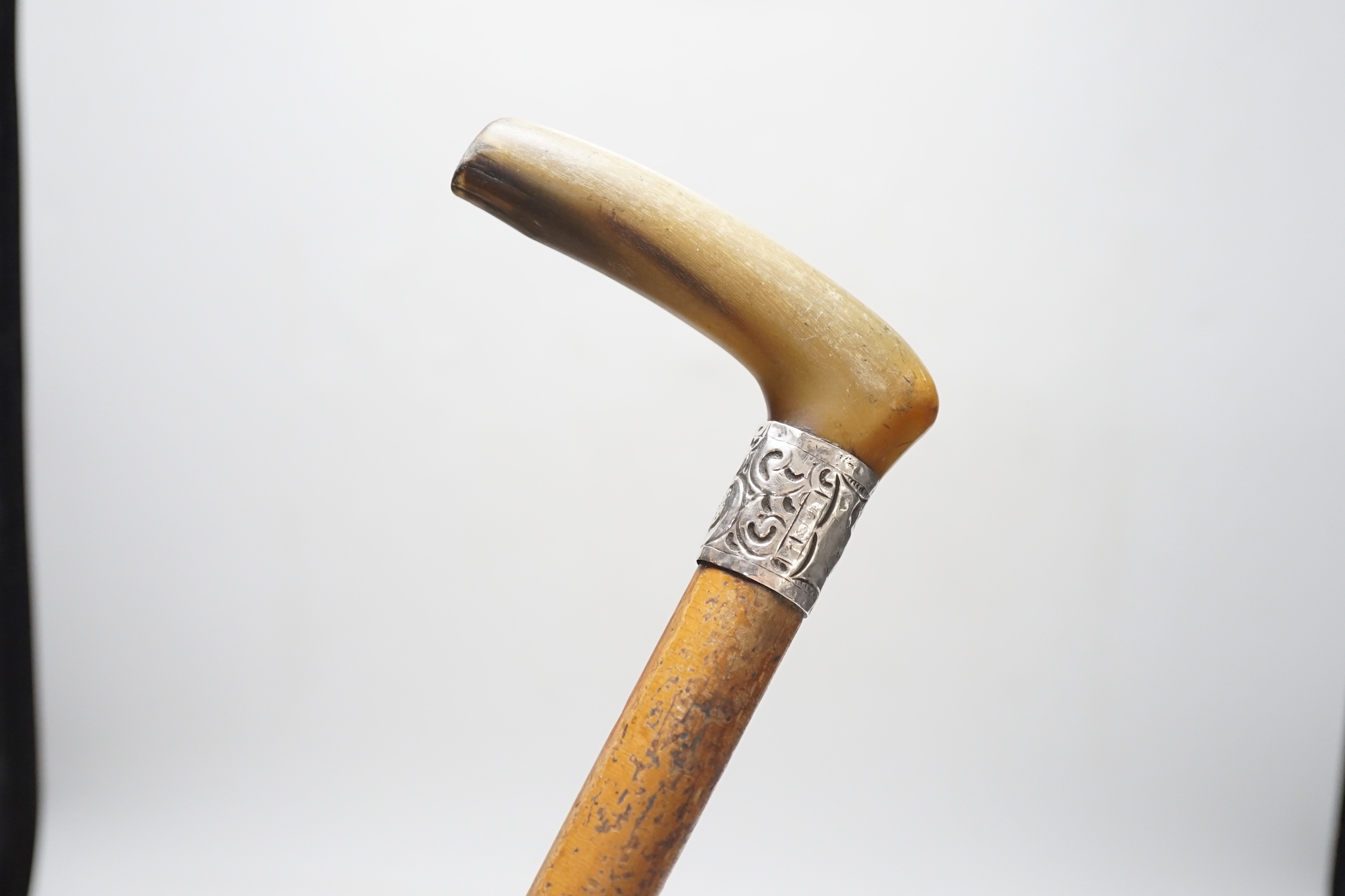 A George V silver and tortoiseshell five piece dressing table set and a silver mounted horn handled malacca walking stick.